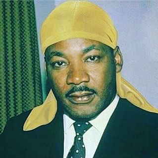 Photograph of Dr. Martin Luther King Jr. wearing a yellow durag.